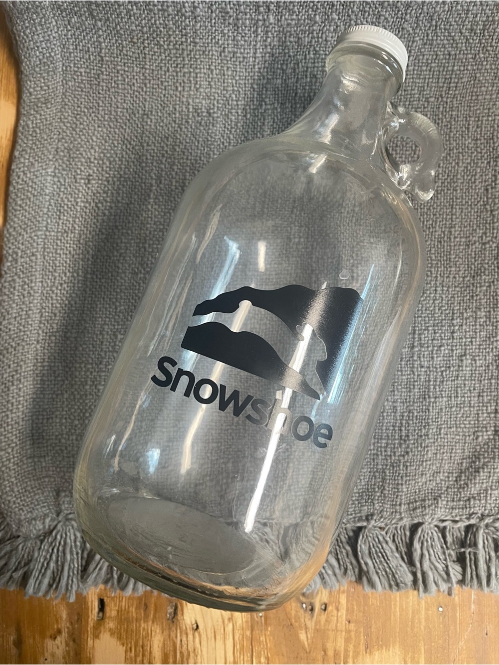 Snowshoe WV Clear Glass Growler with Black Logo